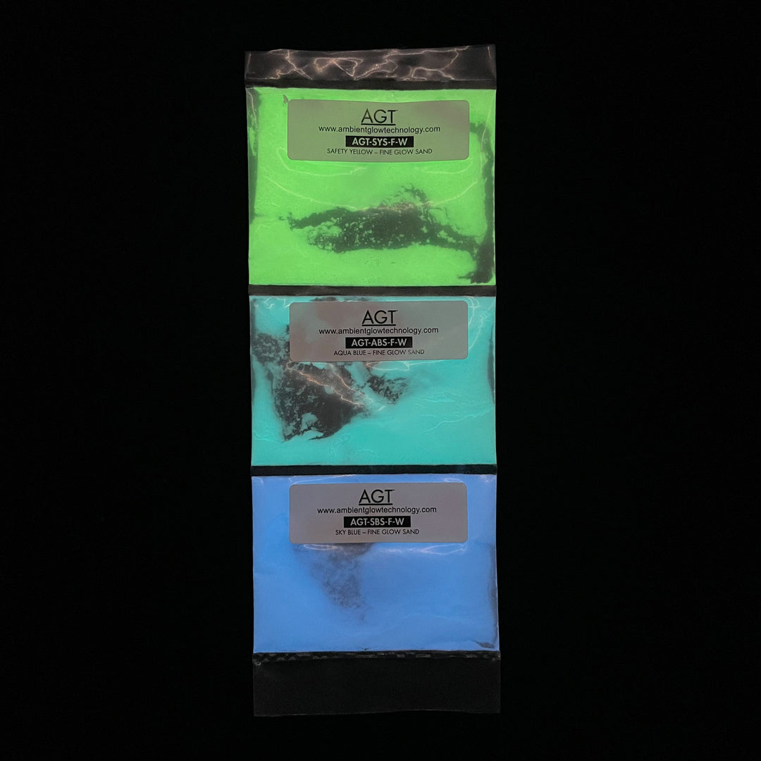 Fine Glow Sand Sample Strip in Sky Blue, Aqua Blue, and Emerald Yellow. Glowing in the dark sand.