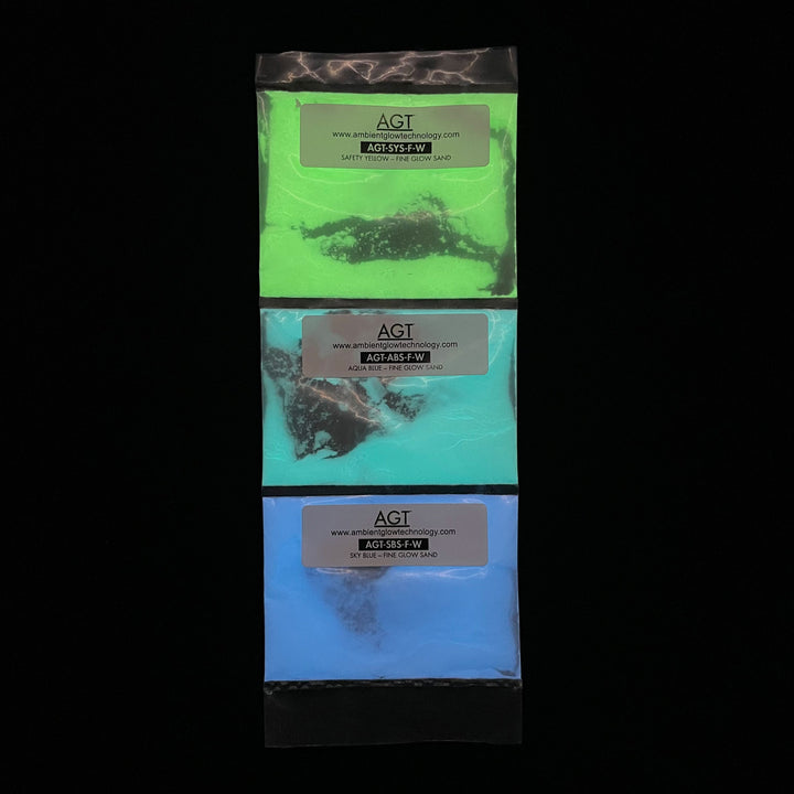 Fine Glow Sand Sample Strip in Sky Blue, Aqua Blue, and Emerald Yellow. Glowing in the dark sand.