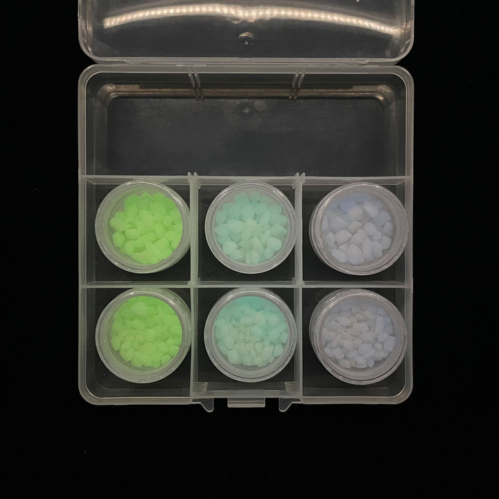 This Premium Glowing Mini Pebble Sample Kit contains AGT™ Glowing Mini Pebble samples in all three colors; Emerald Yellow, Aqua Blue and Sky Blue and in both 1/4" & 1/8" sizes. Day time view.