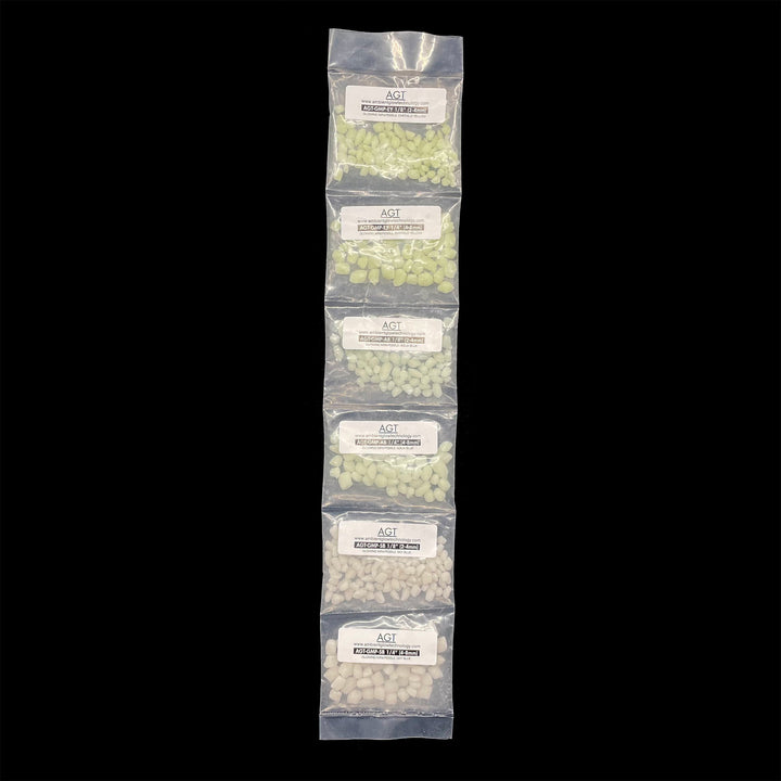 Sample Strip of AGT™ Glowing Mini Pebbles in Emerald Yellow, Aqua Blue and Sky Blue in both 1/4" and 1/8" sizes. Day time view.