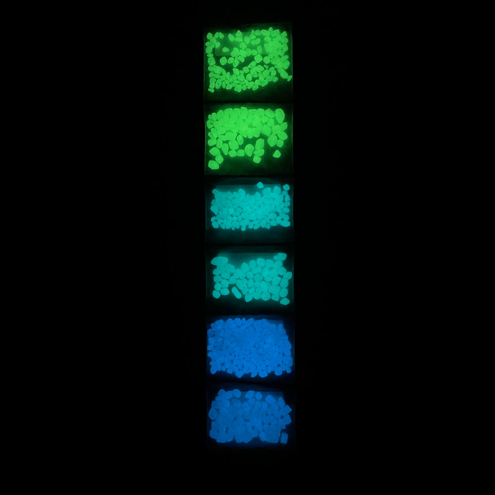 Sample Strip of AGT™ Glowing Mini Pebbles in Emerald Yellow, Aqua Blue and Sky Blue in both 1/4" and 1/8" sizes. Glow in dark pebbles