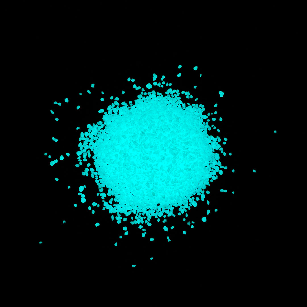 1lb. pile of glowing Aqua Blue Resin Glow Sand