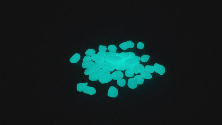 Rotating video of a pile of Aqua Blue Glowing Mini Pebbles