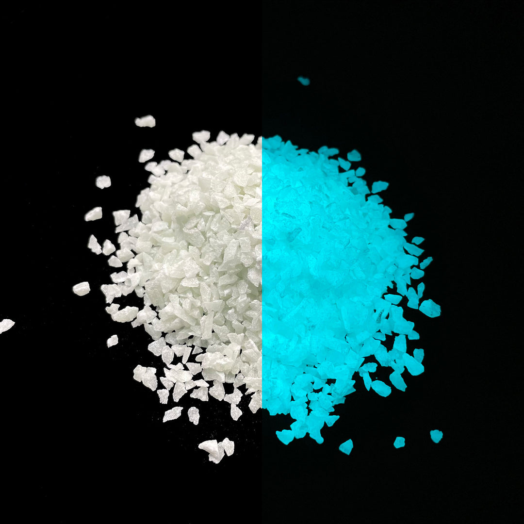 Day and night comparison of a large pile of Aqua Blue Ultra Grade Glow Stones