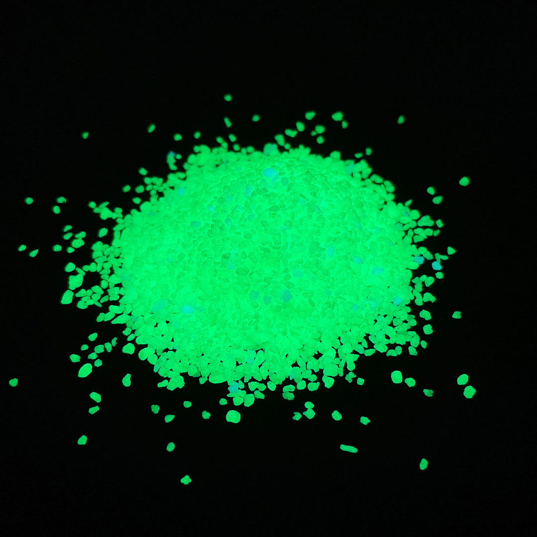 A glow in the dark pile of AGT™ Resin Glow Sand in Safety Yellow.