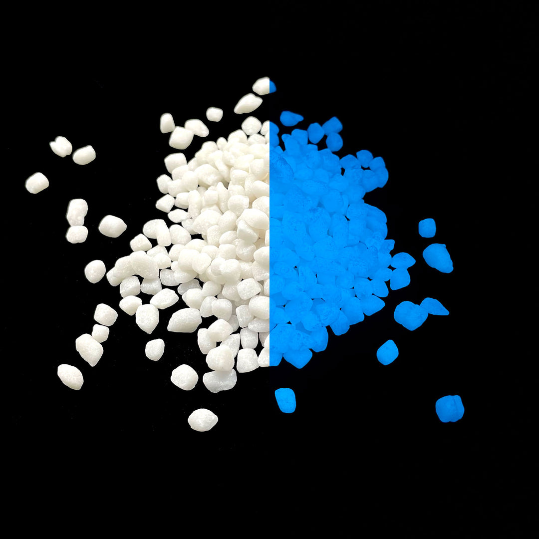 Side by side glow in the dark comparison of AGT™ Sky Blue Mini Pebbles