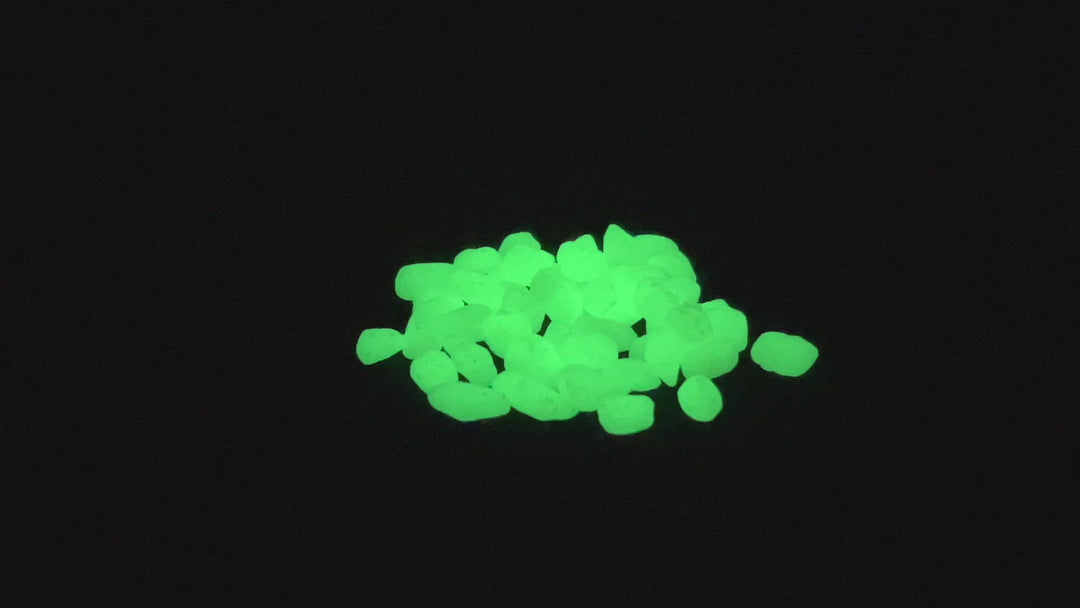 Rotating video of a small pile of Emerald Yellow Glowing Mini Pebbles