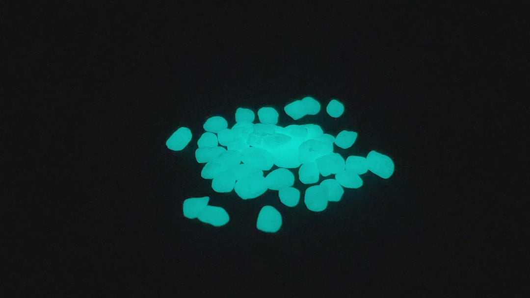 Rotating video of a pile of Aqua Blue Glowing Mini Pebbles